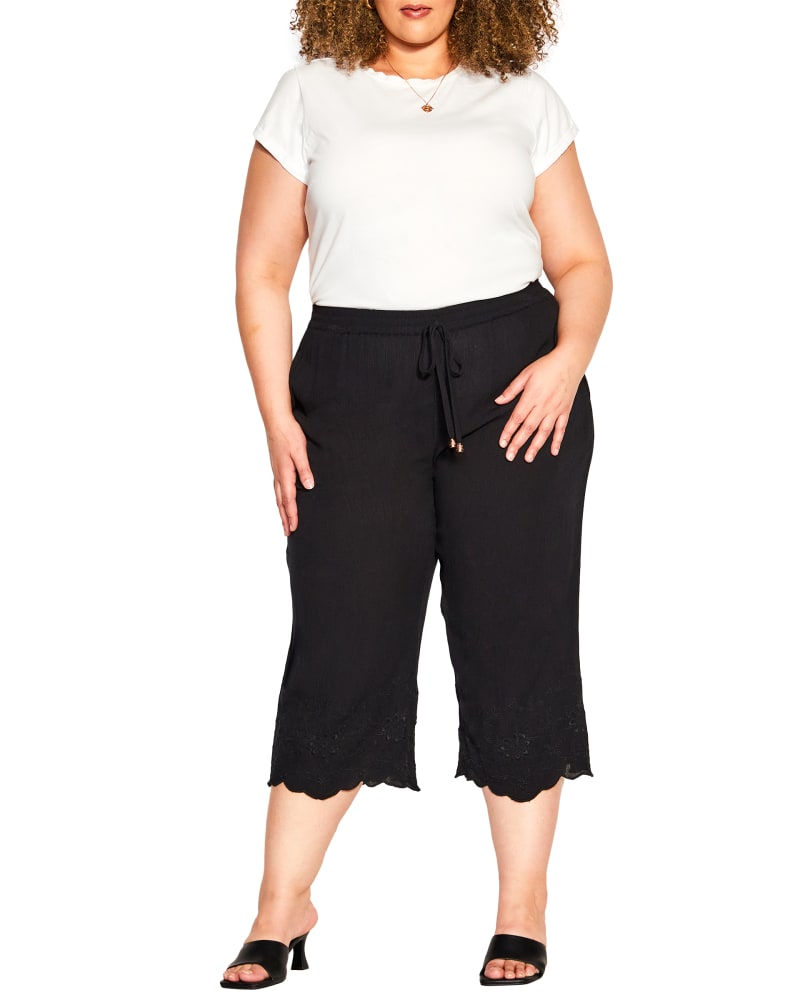 Front of a model wearing a size 18 PANT EMBROIDERED HEM in Black by avenue. | dia_product_style_image_id:298482